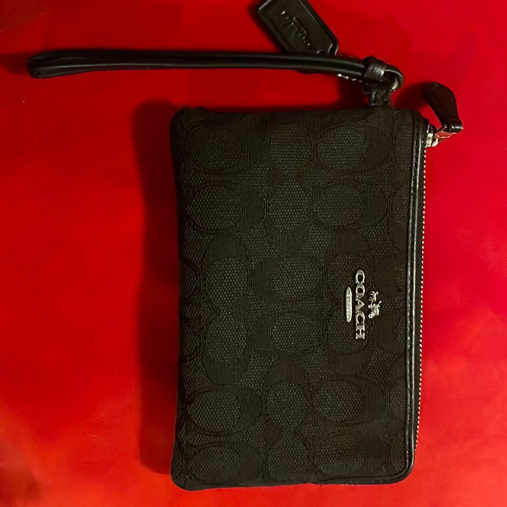 I’m selling a coach like new wallet my iPhone12  fits in it.